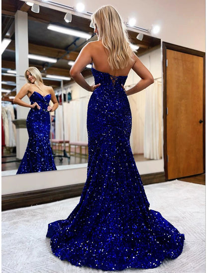 Back view of a sequined mermaid formal gown with a sweep train.