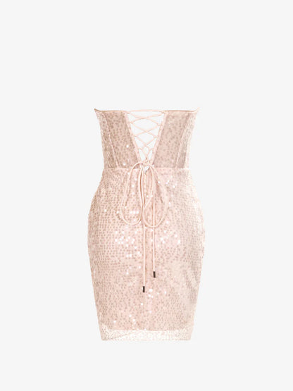 Back view of a model in a pink sequined sweetheart sheath dress.
