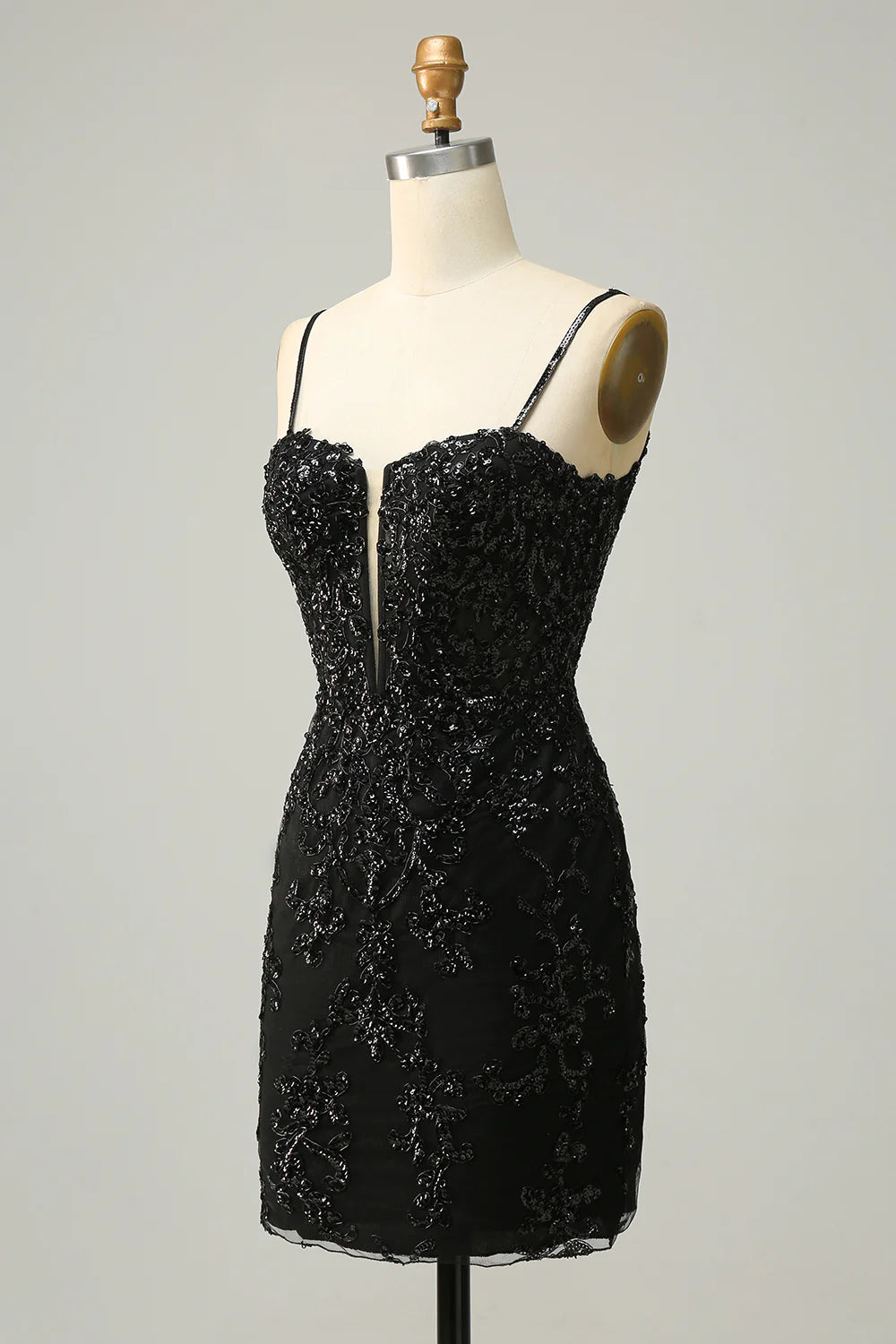Side view of a black sequin short dress.