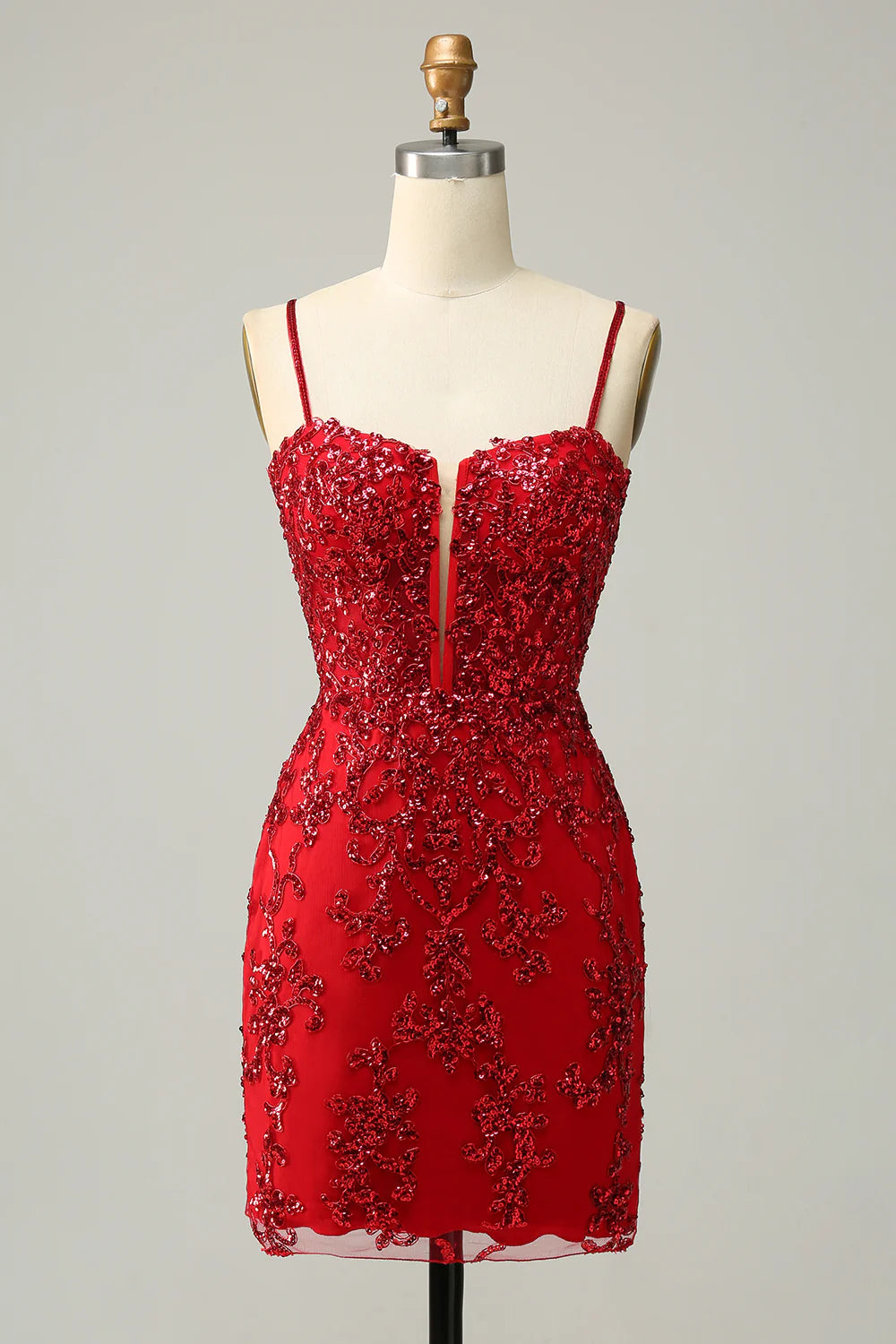 Model wearing a vibrant red sequined sheath homecoming dress.