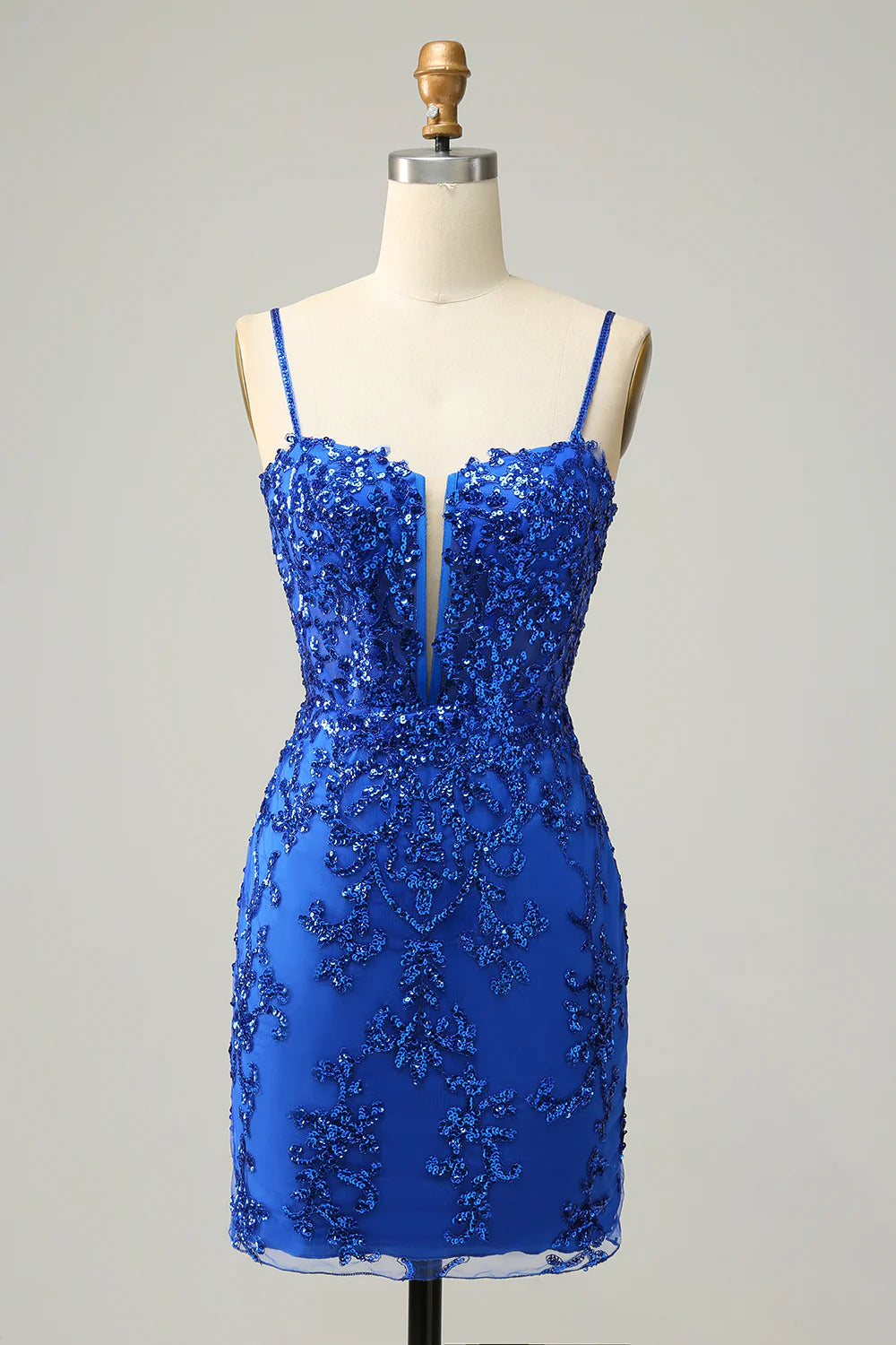 Model wearing a royal blue sequined sheath homecoming dress.