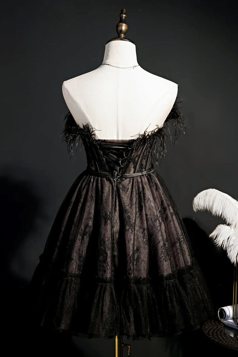 Close-up of the tiered tulle skirt on a black homecoming dress.