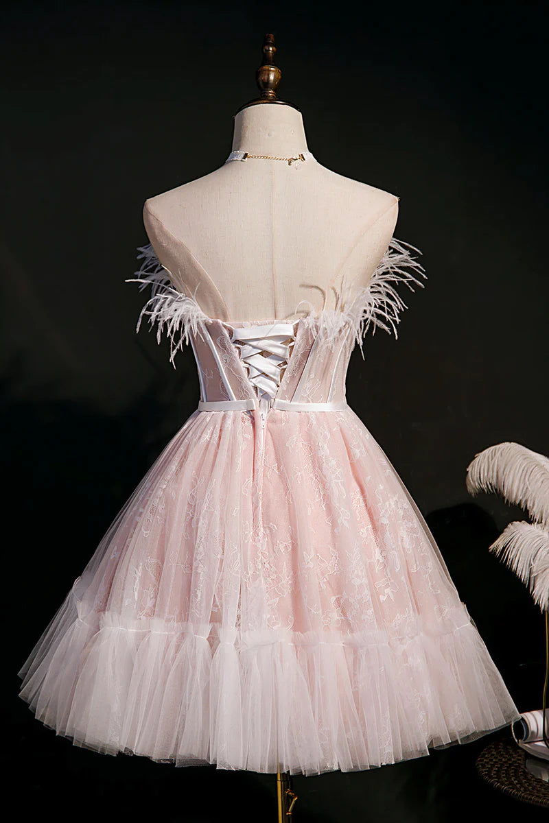 Detail of the strapless bodice and tulle fabric of the black dress.