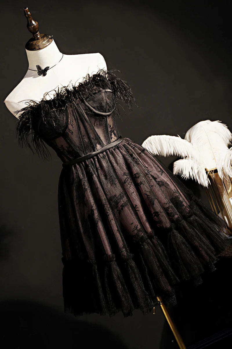Full view of a black strapless A-line tulle short dress.
