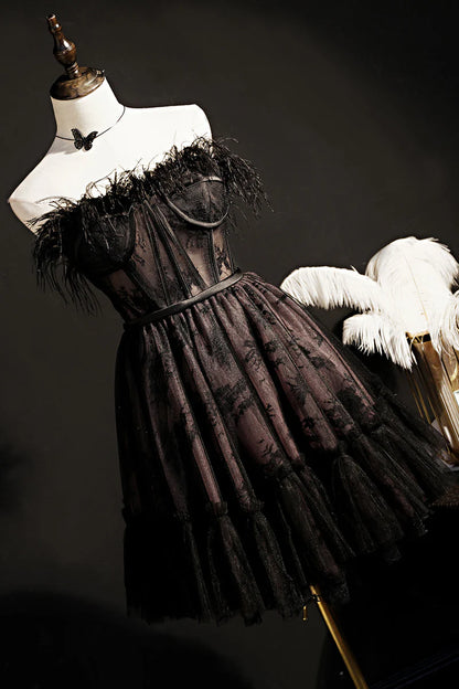 Full view of a black strapless A-line tulle short dress.