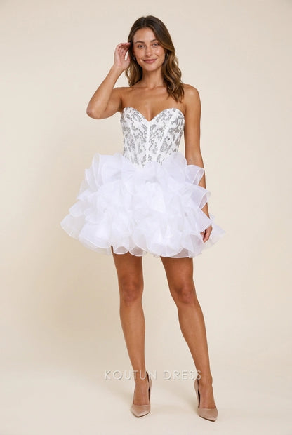 Model wearing a sparkling white strapless sequin ruffled short homecoming dress.