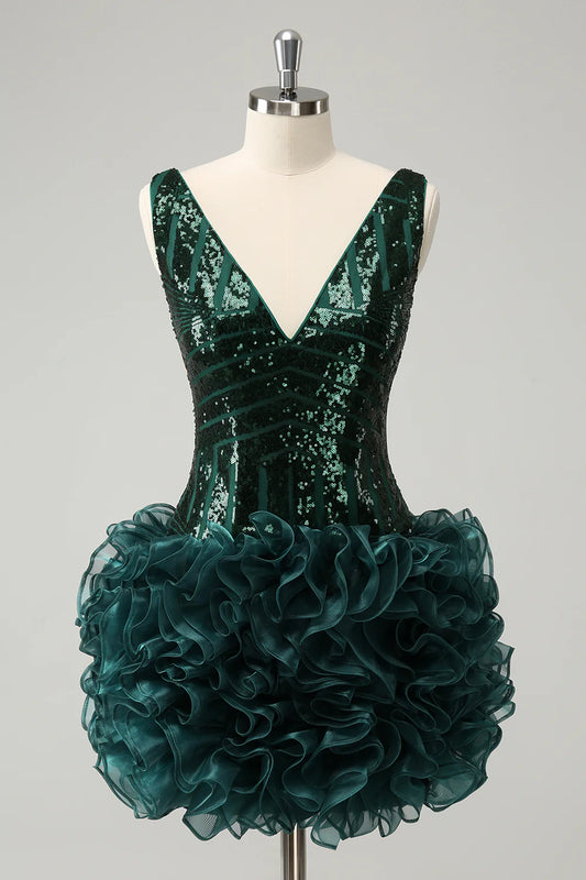 Model wearing a dark green sequin V-neck dress with detachable ruffles.
