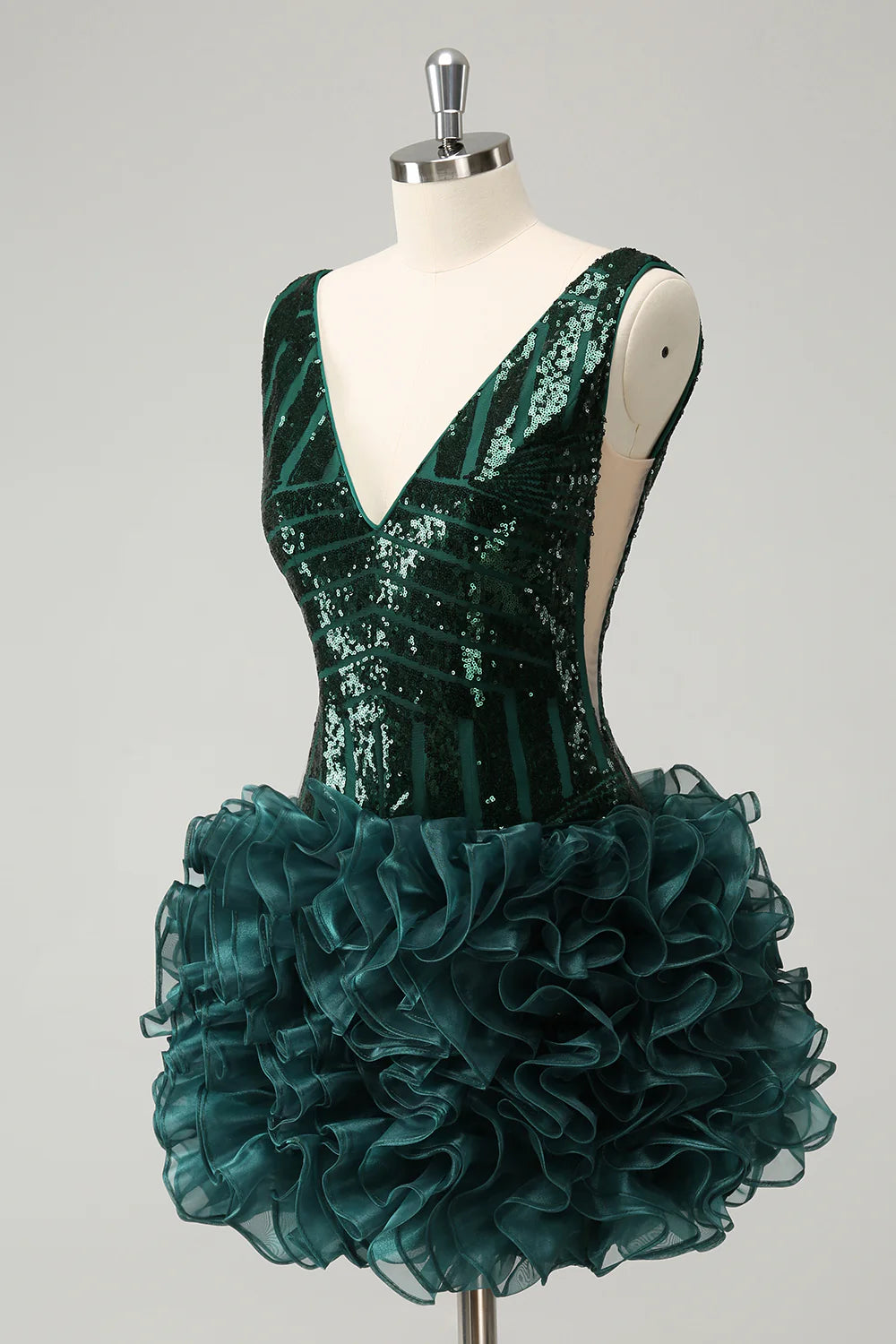 Full view of the dark green A-line sequin gown.