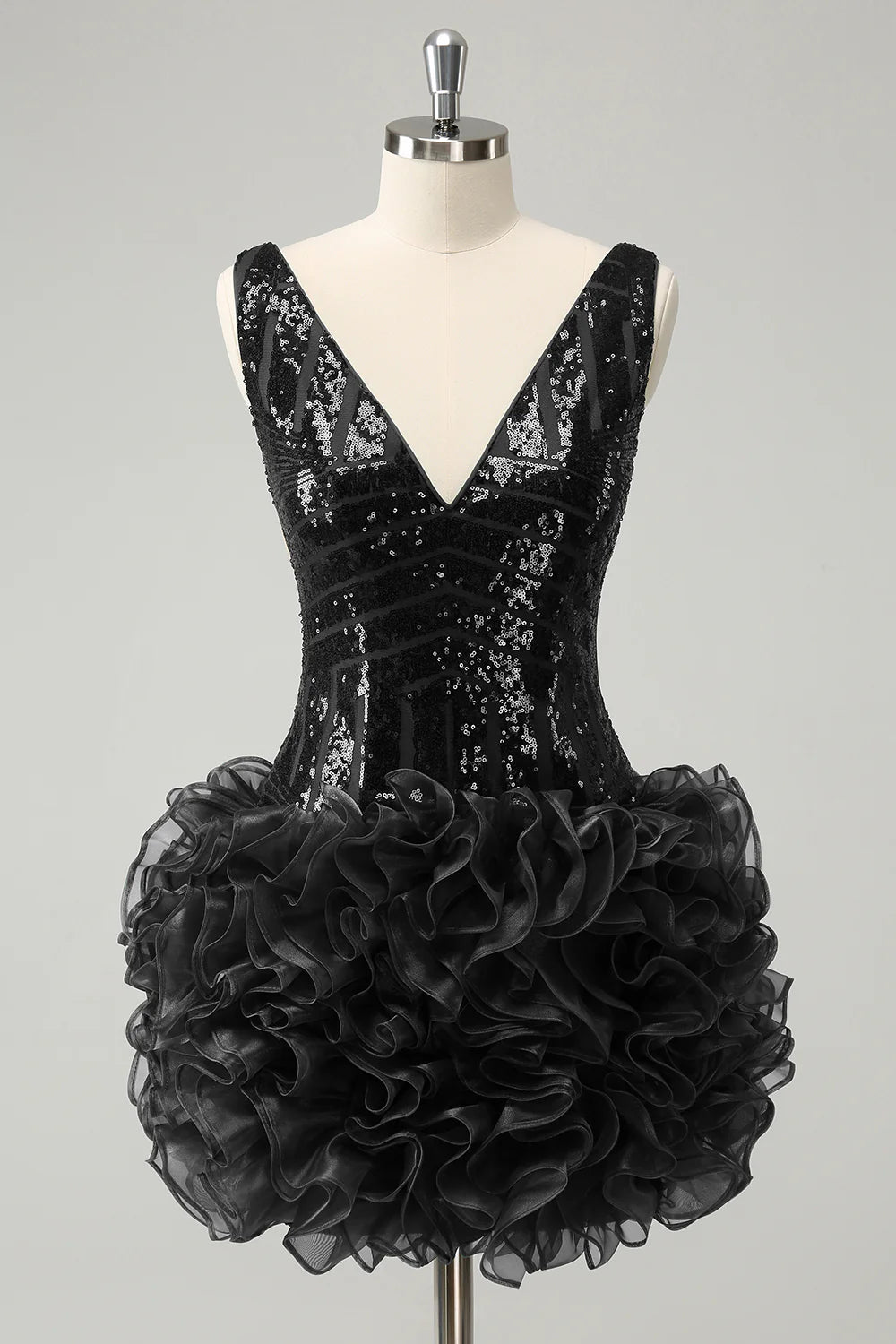 Side profile of the dark green V-neck sequin gown.