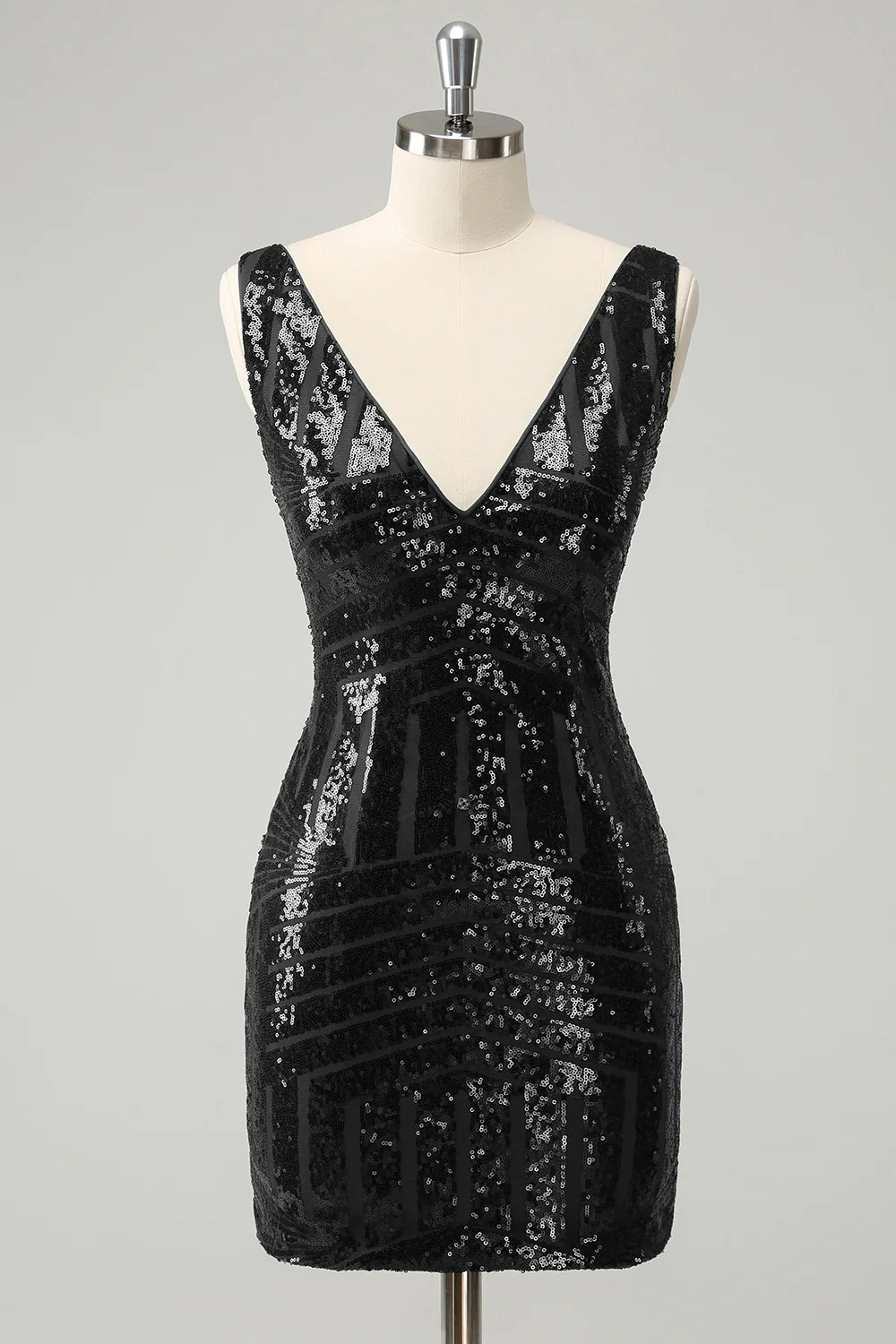 Detail of the detachable ruffles on the dark green sequin dress.