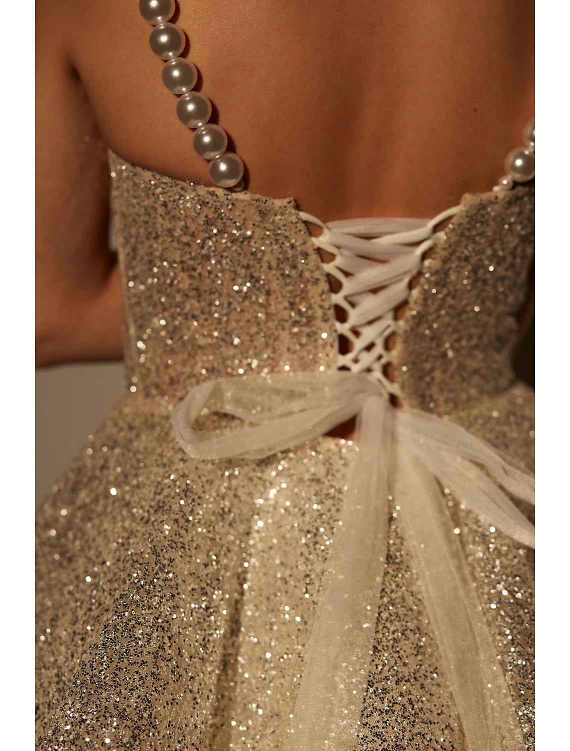 Side view of a pink A-line glitter tulle cocktail dress.