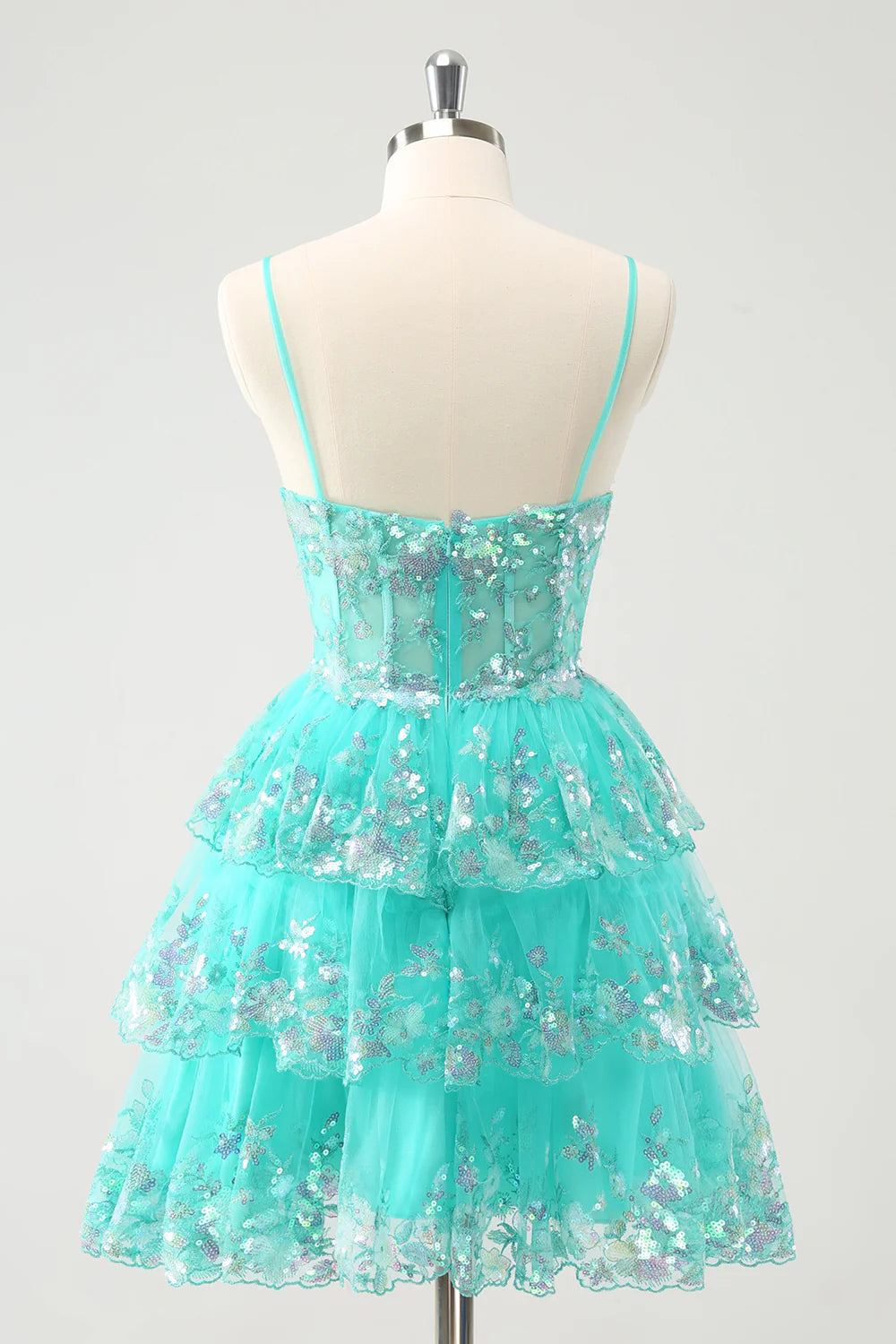 Side view of the green sequin A-line dress, showcasing tiered skirt details.