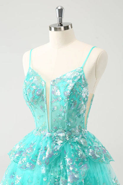 Model posing gracefully in the dazzling green A-line homecoming gown.