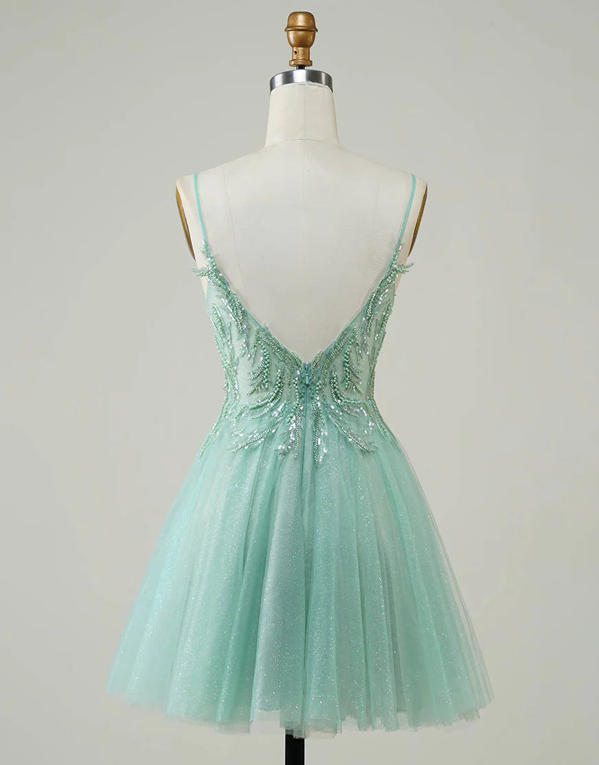 Close-up of the beaded bodice on the green A-line dress.