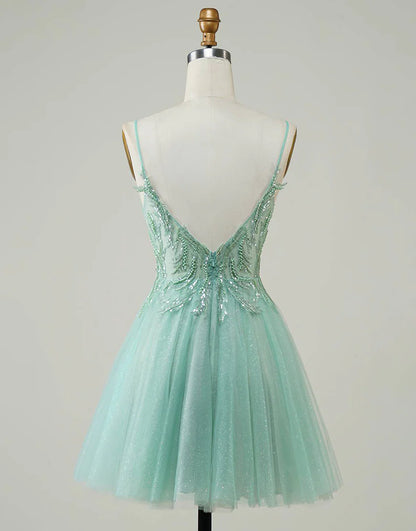 Close-up of the beaded bodice on the green A-line dress.
