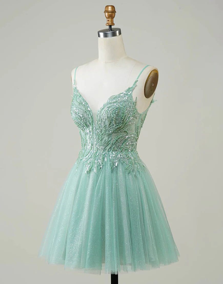 Back view of the sparkly green mini homecoming dress.