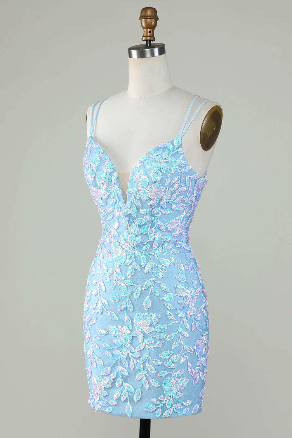 Close-up of the lace-up back and sparkly fabric on the light blue dress.