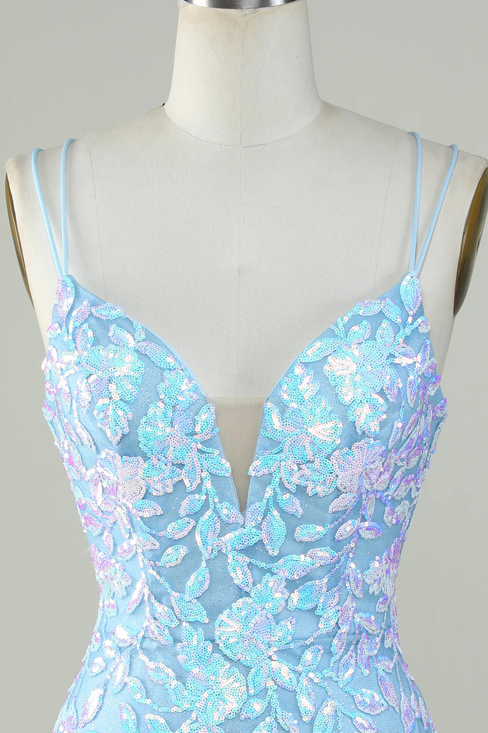 Light blue sparkly V-neck dress, back view, highlighting the lace-up detail.