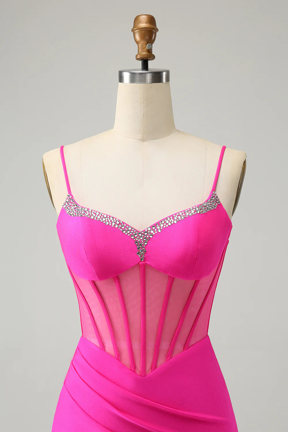 Side view of fuchsia sparkly beaded corset short homecoming dress.