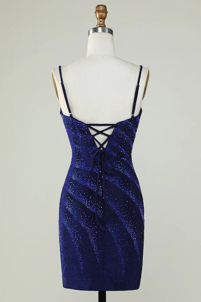 Side view of a woman wearing the royal blue sparkly formal dress.