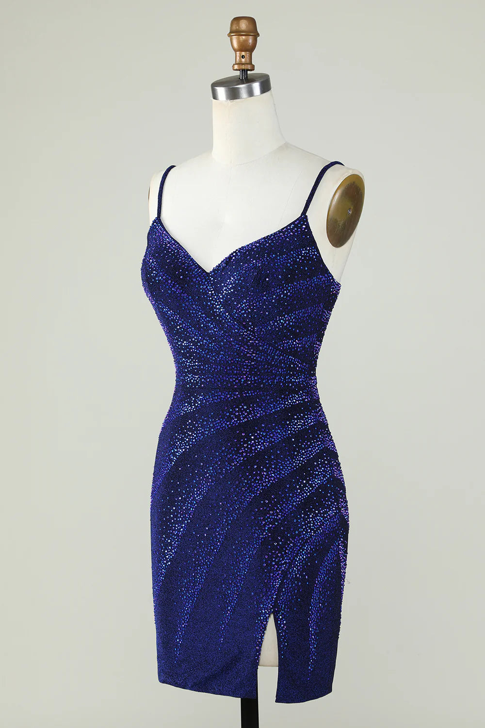 Close-up of the intricate beading and V-neckline on the royal blue dress.