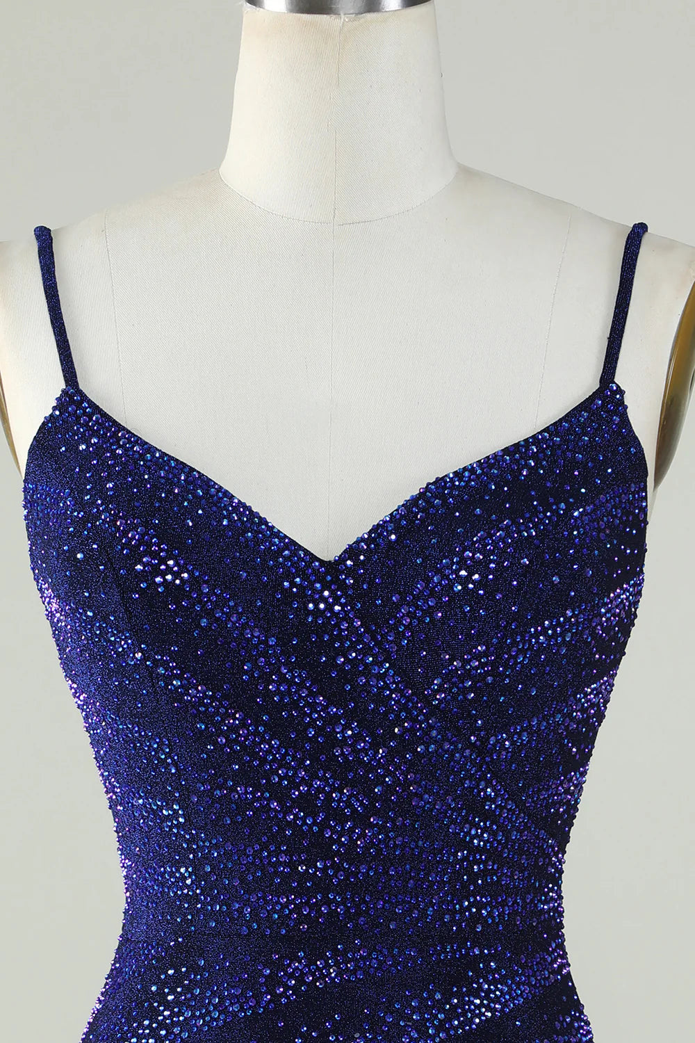 Back view of the royal blue floor-length spaghetti strap dress.