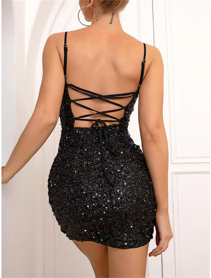 Woman walking in a black sequin mini dress, showing movement.