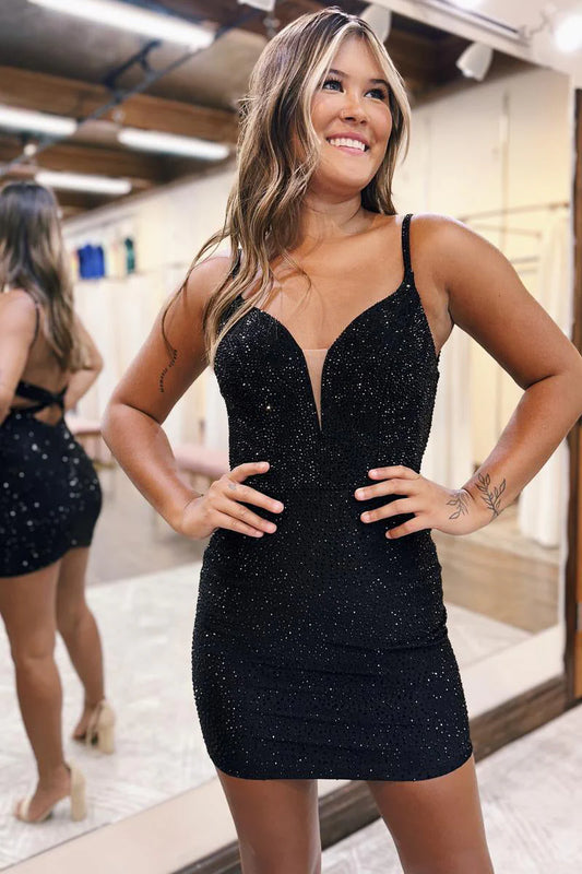 Sparkly bodycon V-neck mini dress with cross back detail.