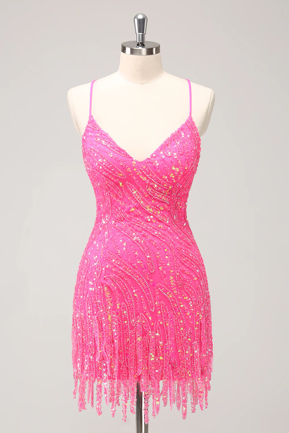 Sparkly hot pink sequin bodycon dress with V-neck and fringes.