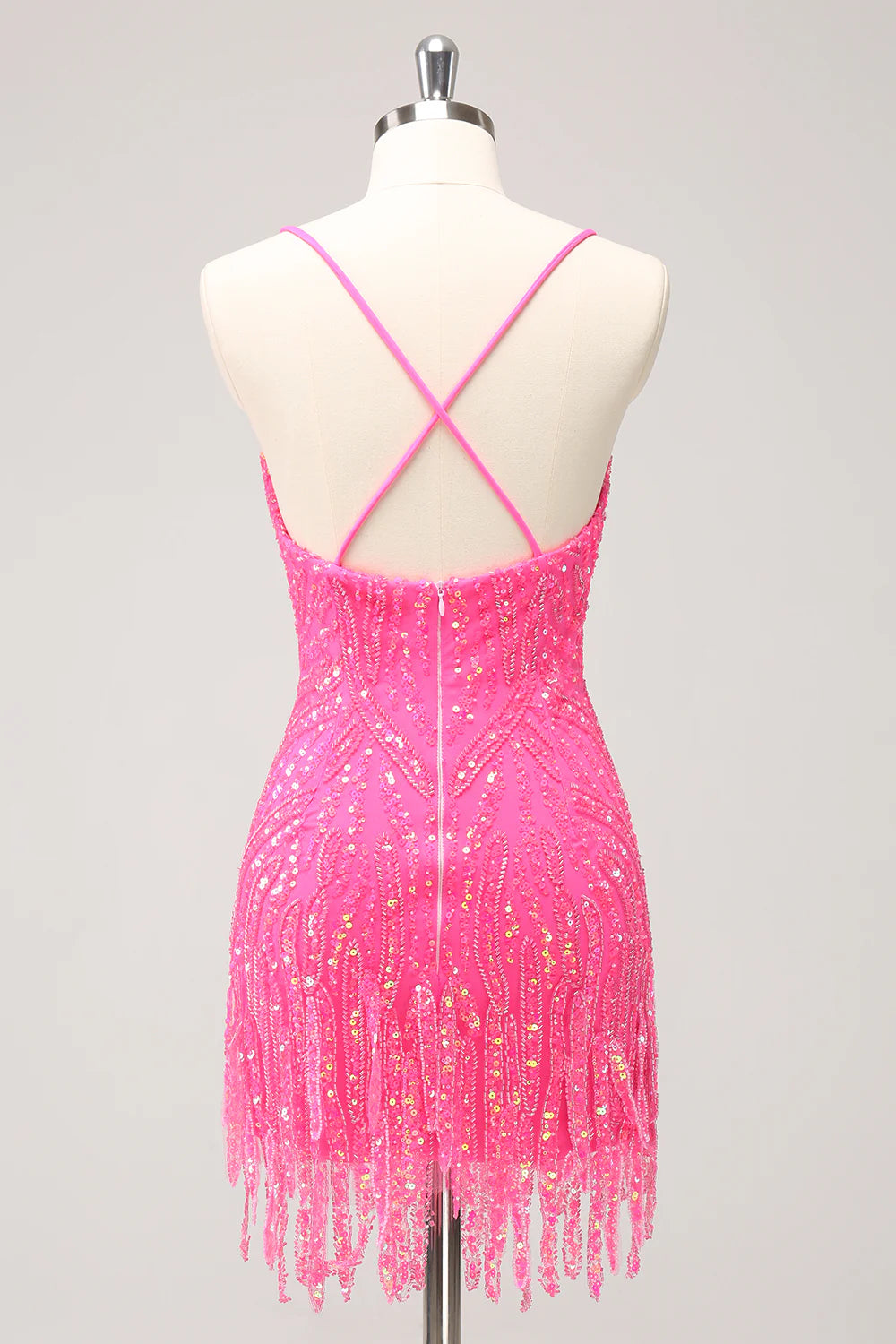 Back view of a hot pink sequin bodycon dress with V-neck and fringes.