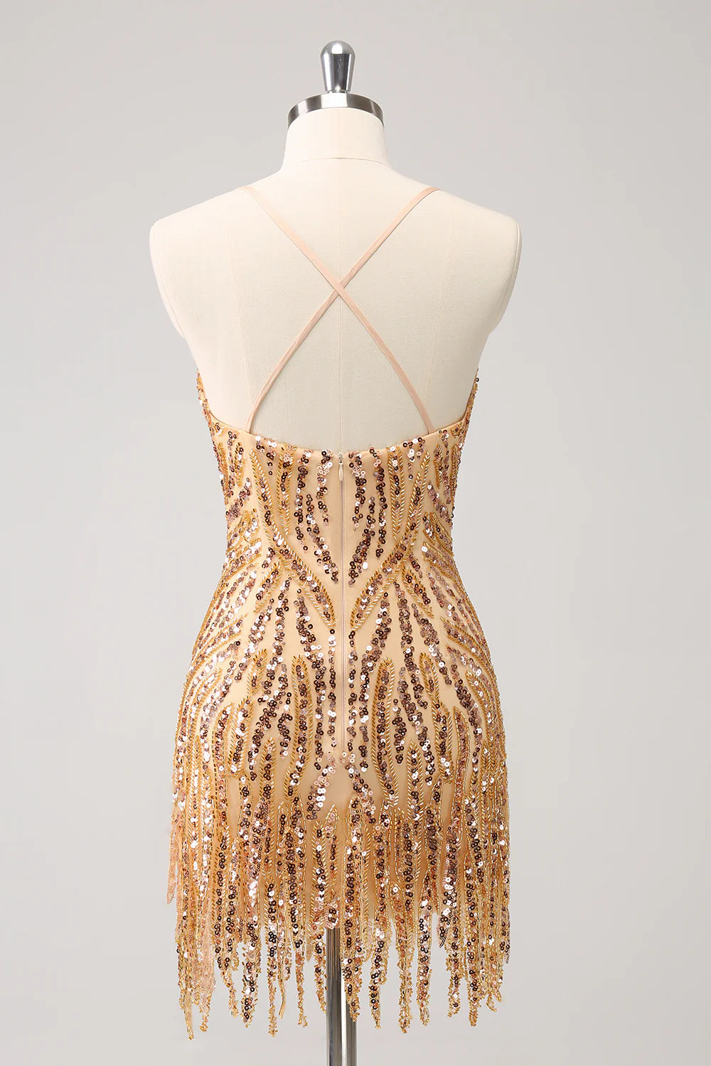 Back view of a gold sequin bodycon dress with V-neck and fringes.