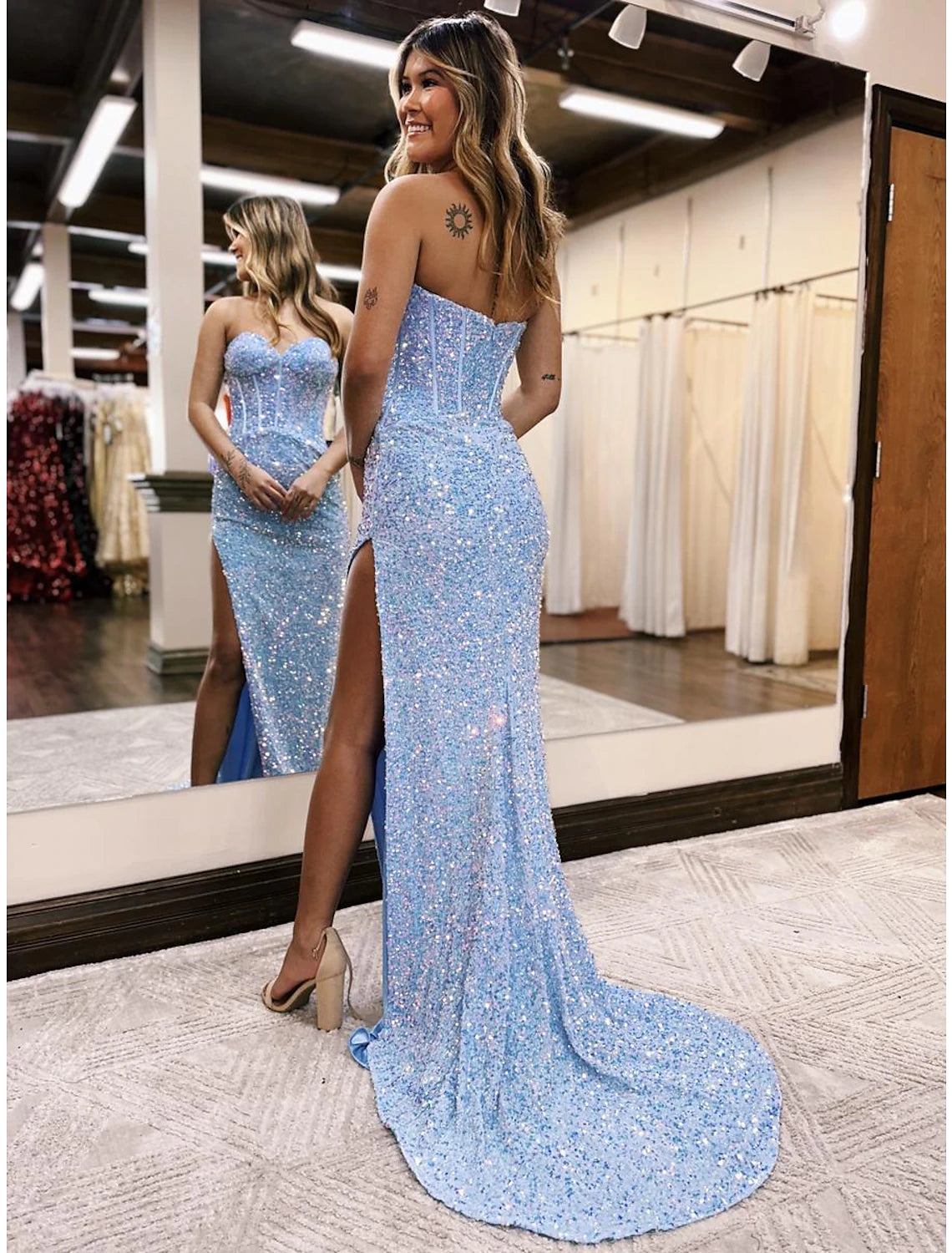 Elegant sleeveless sequined dress for formal events.