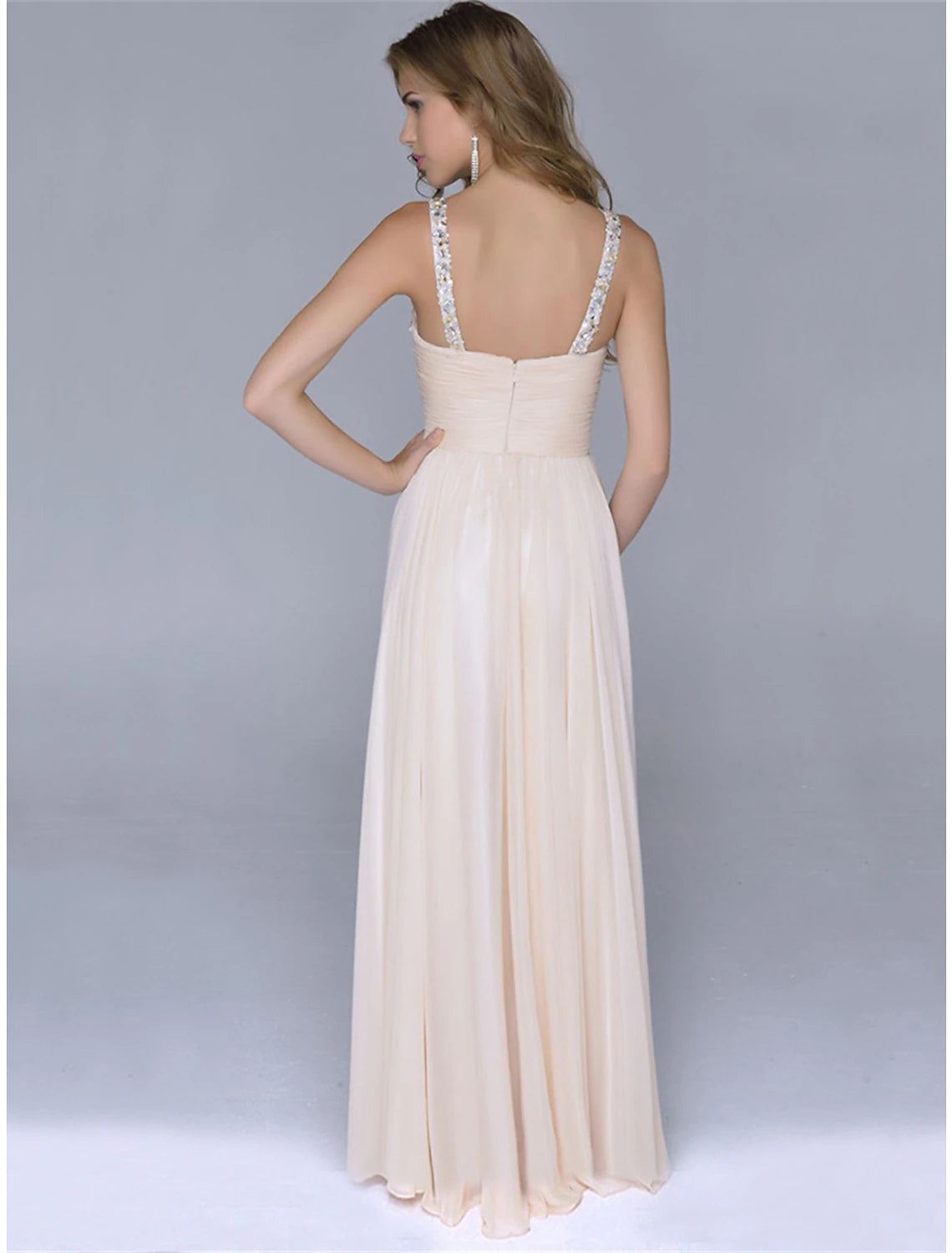Sparkly sequin maxi dress with spaghetti straps, showcasing the shimmering fabric.