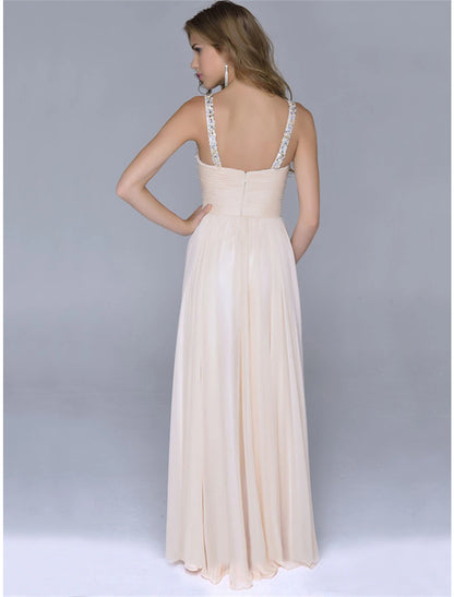 Sparkly sequin maxi dress with spaghetti straps, showcasing the shimmering fabric.