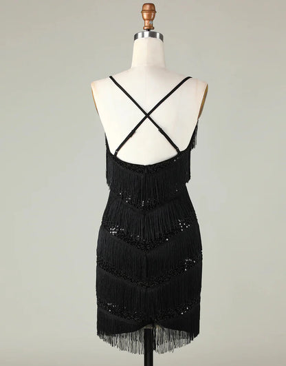 Back view of a black sparkly V-neck short homecoming dress with tassels.