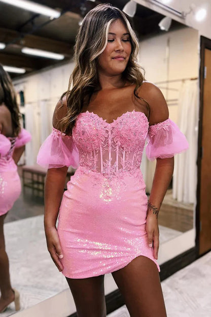 Sparkly pink corset homecoming dress with detachable short sleeves and sequin lace details.