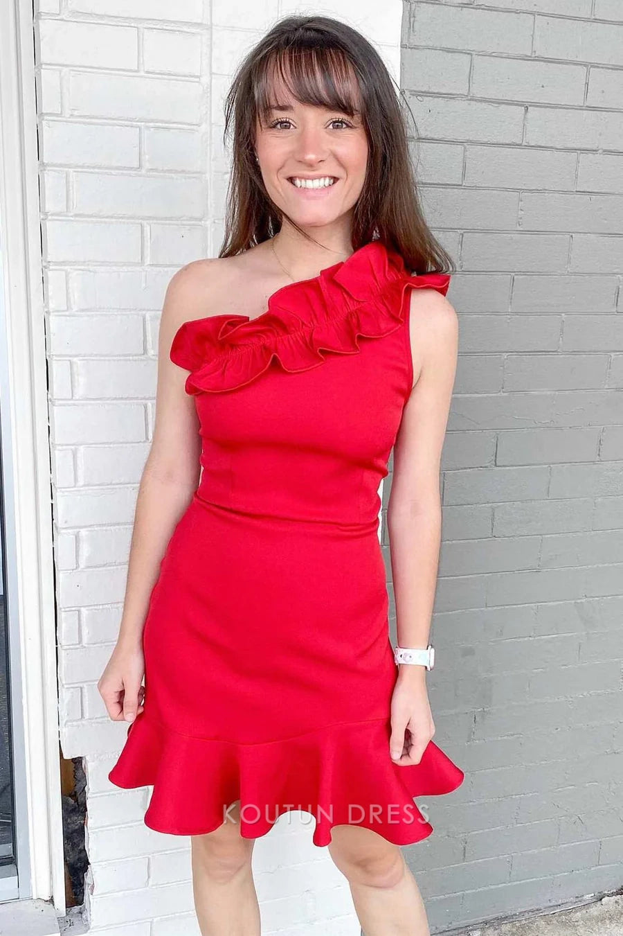 Side view of the red one-shoulder bodycon mini dress with ruffle details.