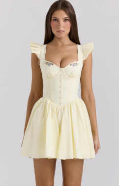 Front view of a sleeveless floral print mini dress for homecoming.