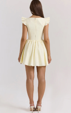 Side view of the floral print mini dress, showing strap detail.