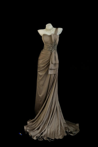 Taupe One Shoulder Prom Dress With Crystal Starburst Embellishment And Satin Drape Formal Prom Dress