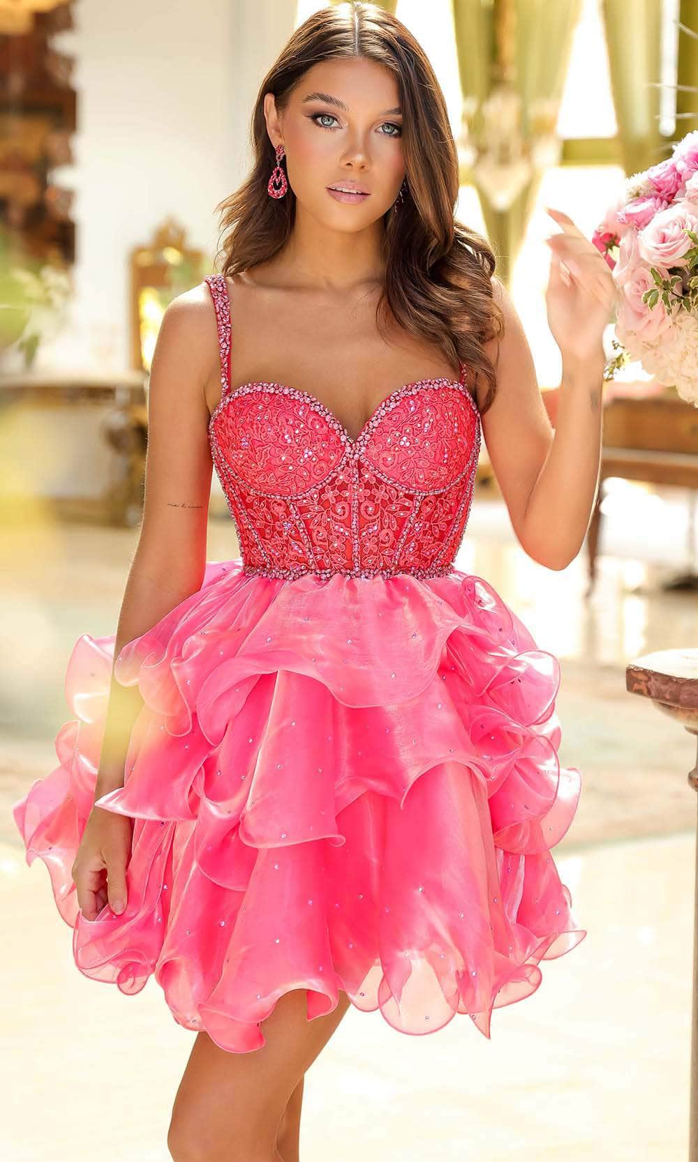 Model wearing a pink sweetheart beaded corset tiered organza mini homecoming dress.