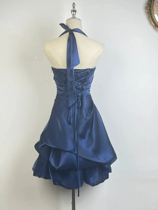 Back view of Koutun satin homecoming dress with corset lace-up detail.