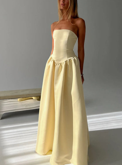 Yellow Strapless Prom Dress with Structured Corset Bodice and Voluminous Ball Gown Skirt for Formal Events and Prom Nights