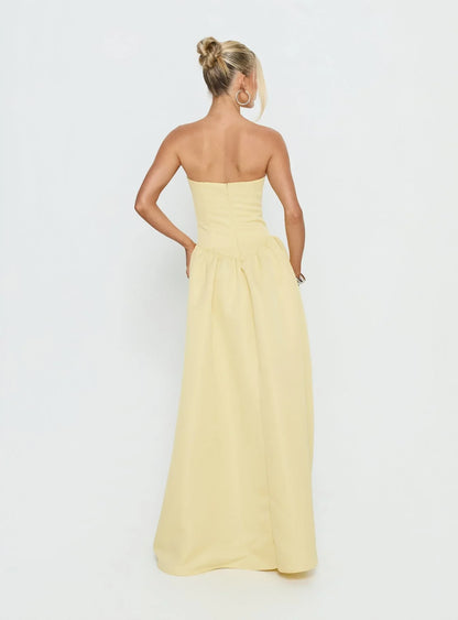 Yellow Strapless Prom Dress with Structured Corset Bodice and Voluminous Ball Gown Skirt for Formal Events and Prom Nights