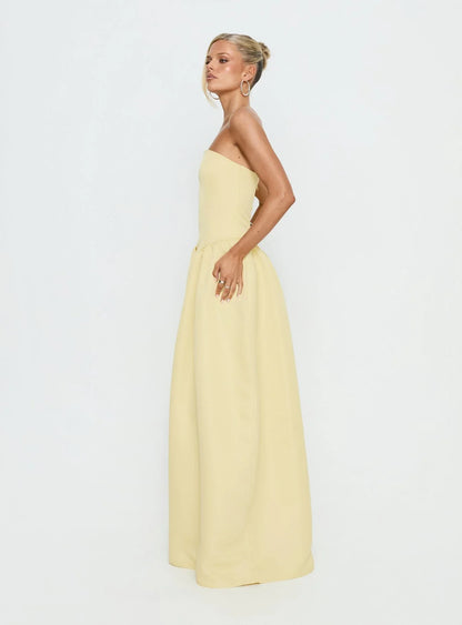 Yellow Strapless Prom Dress with Structured Corset Bodice and Voluminous Ball Gown Skirt for Formal Events and Prom Nights