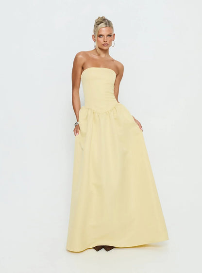 Yellow Strapless Prom Dress with Structured Corset Bodice and Voluminous Ball Gown Skirt for Formal Events and Prom Nights