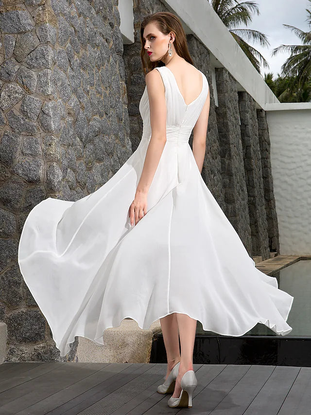 Side view of the asymmetrical A-line beach wedding dress, highlighting the ruched side-draped detail.