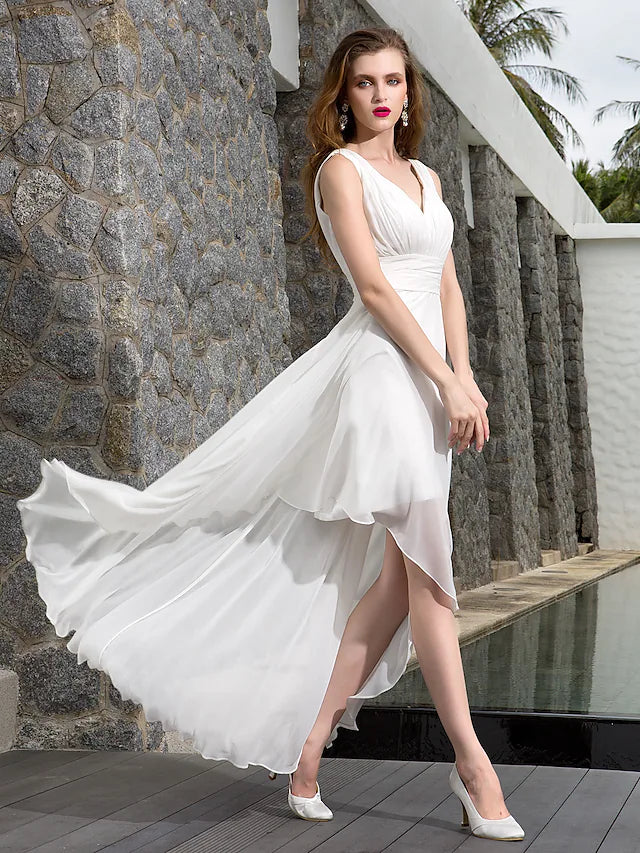 Full length view of the elegant asymmetrical A-line beach wedding dress in motion.