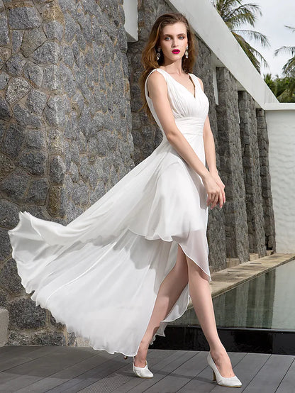 Full length view of the elegant asymmetrical A-line beach wedding dress in motion.