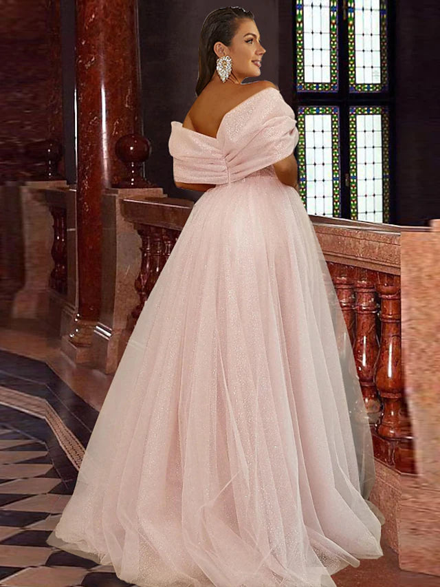 Back view of the A-line off-shoulder prom dress showing pleats and flowing skirt.